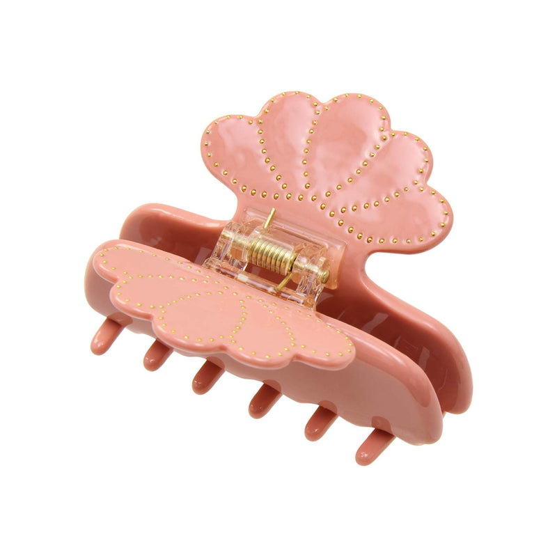 Pink hair clip with gold accents on a white background