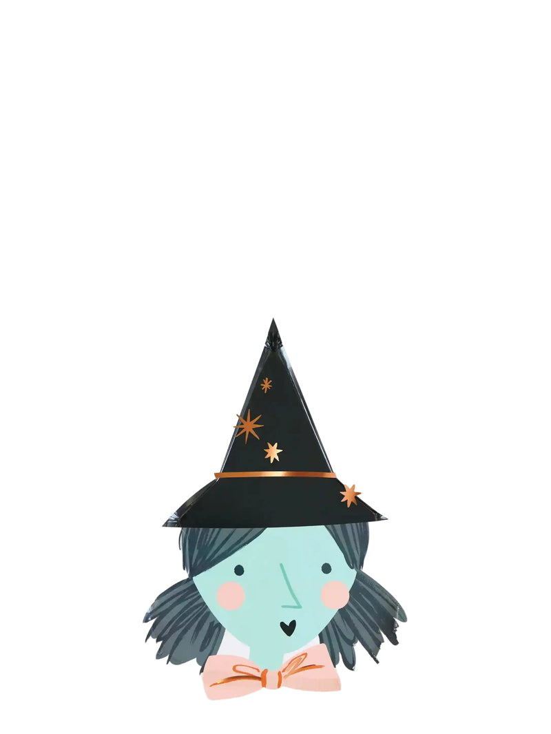 Paper plates featuring witch character with a black pointed hat decorated with small gold stars, a pale blue face, dark gray hair, and a peach bow tie, centered on a light gray background.