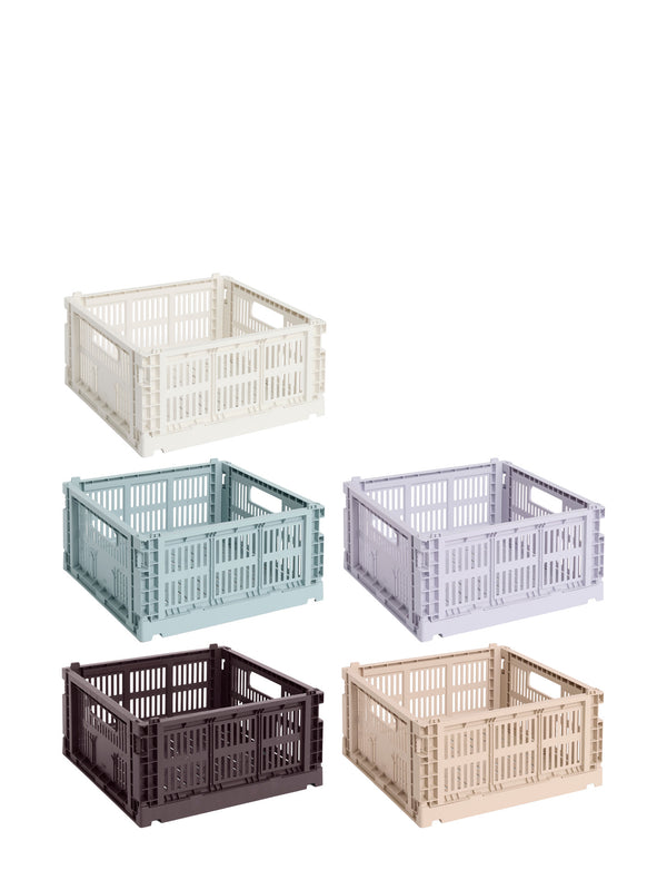 Set of five colorful storage crates on a white background