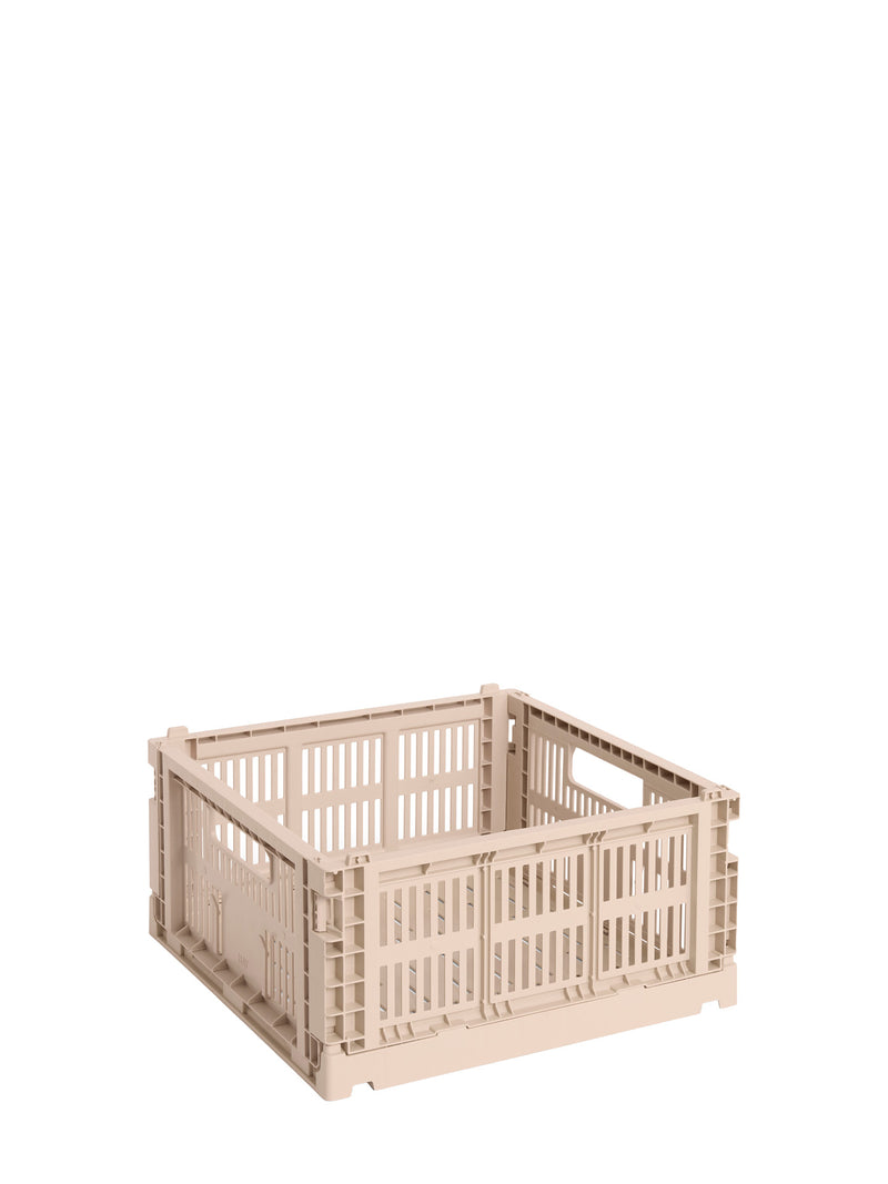 Powder pink storage crate on a white background