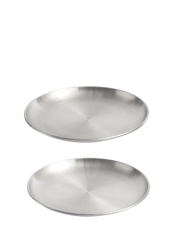 Two round brushed stainless steel plates with very slim design and low rim shown on a plain white background.