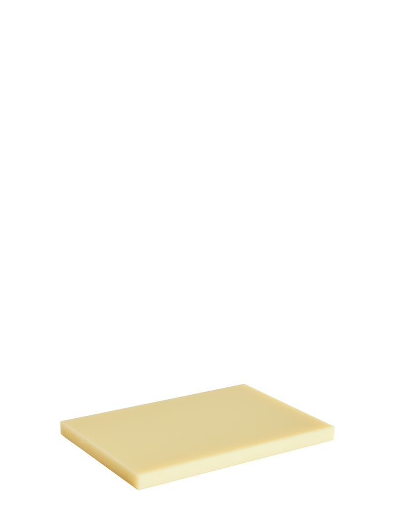 Rectangular light yellow cutting board made of plastic