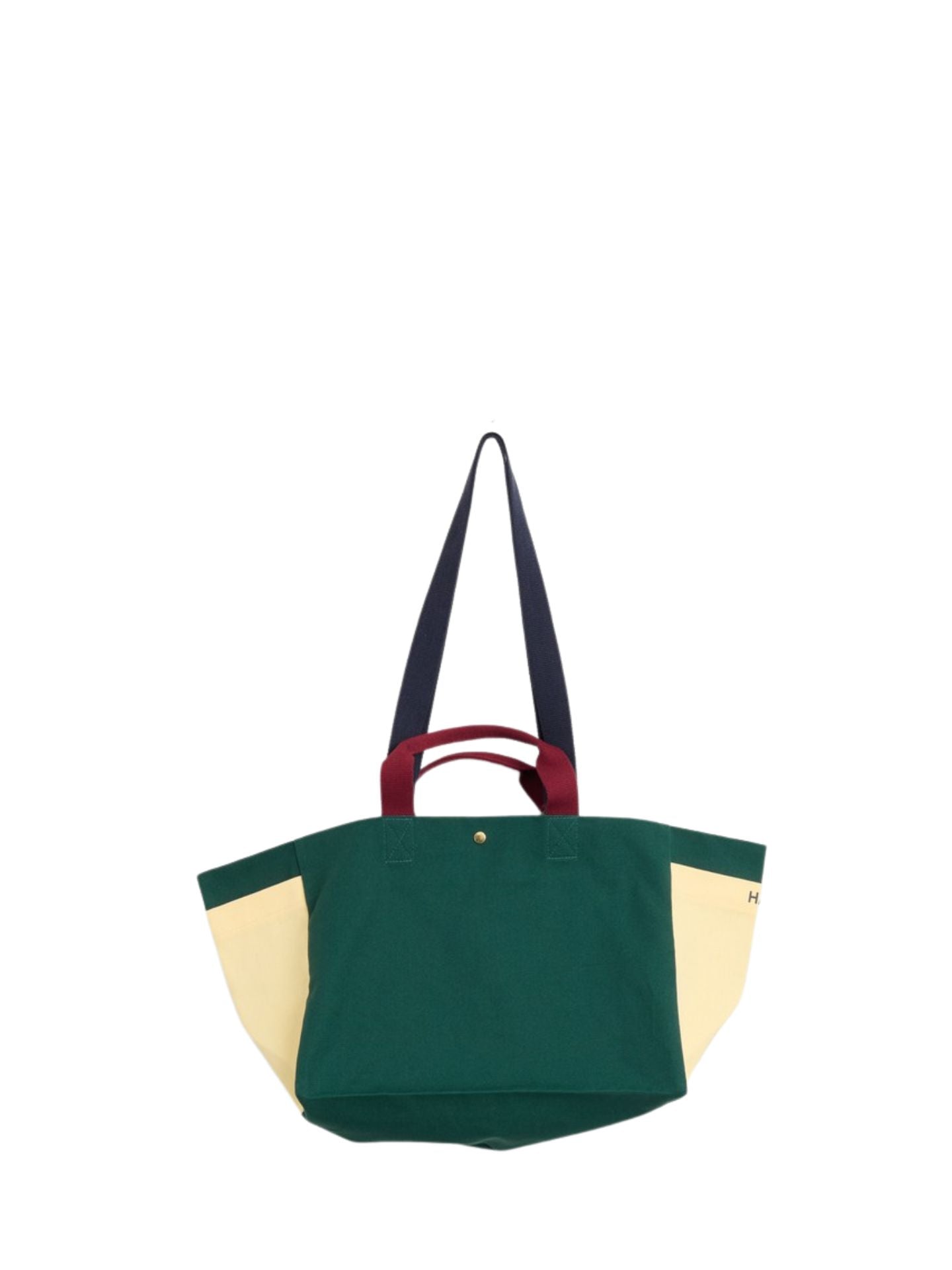 Multicolored tote bag with green, butter yellow, and red sections on a white background
