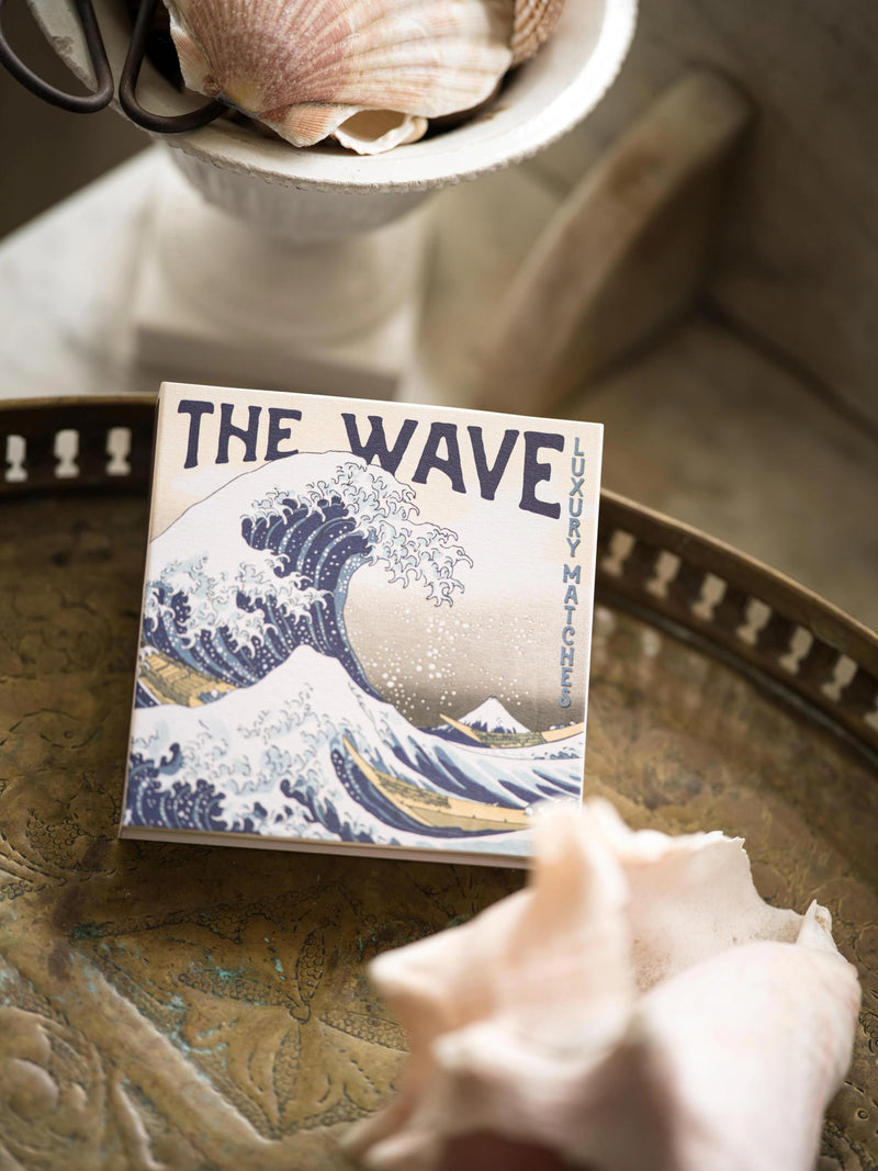 Matches titled 'The Wave' with a wave design on a decorative tray.