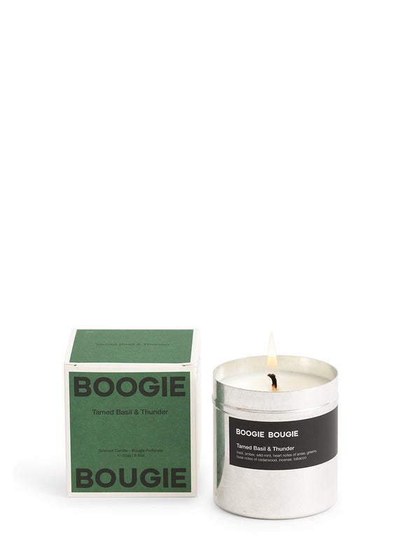 Candle with green 'Boogie Bougie' packaging on a white background