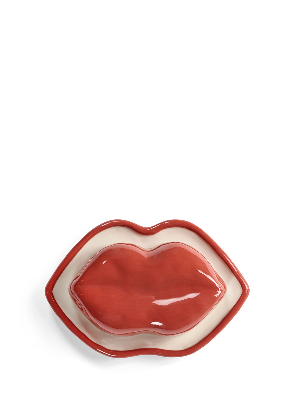 Lip-shaped ceramic dish on a white background
