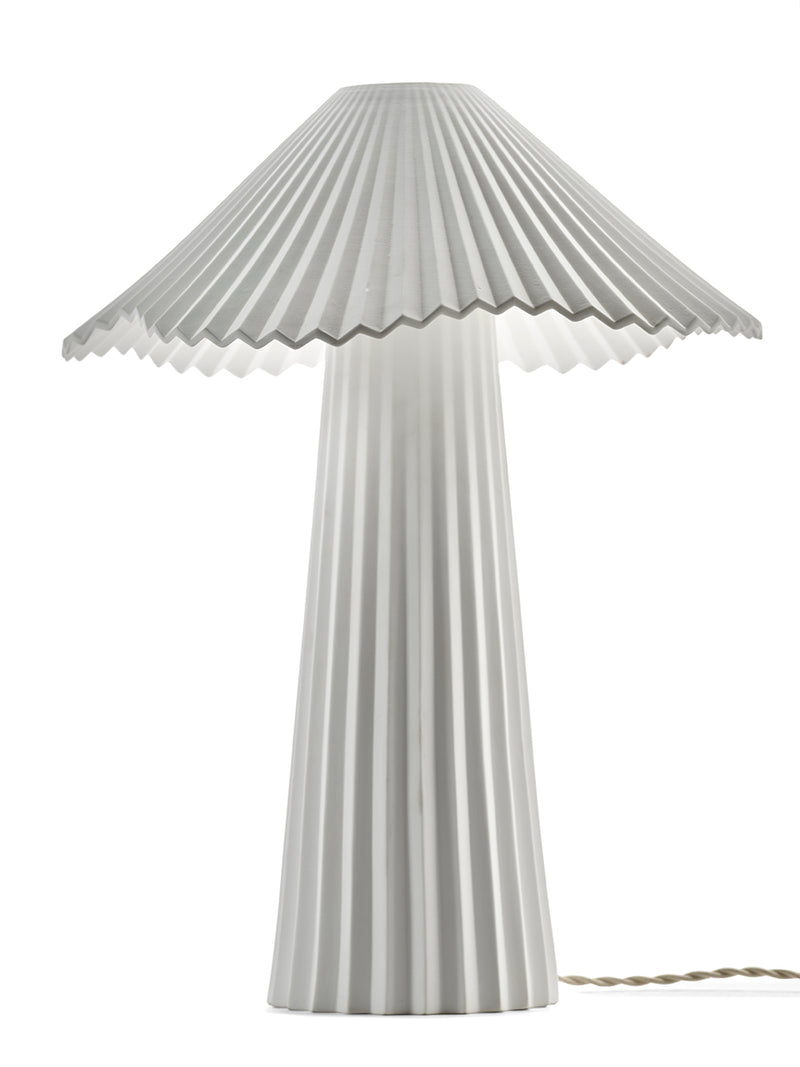 Striped lamp with pleated design on a white background