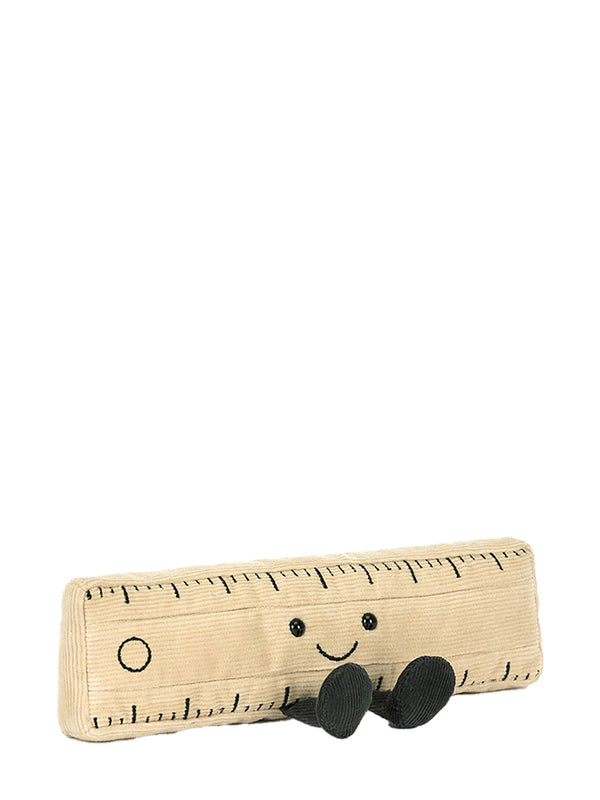 Soft toy ruler with a smiley face and black shoes on a white background