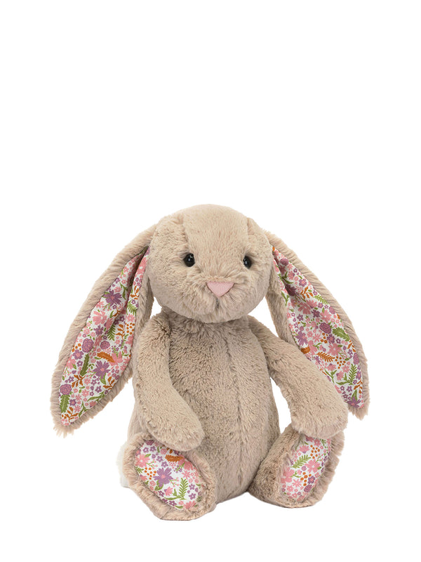 Plush bunny toy with floral ears on a white background