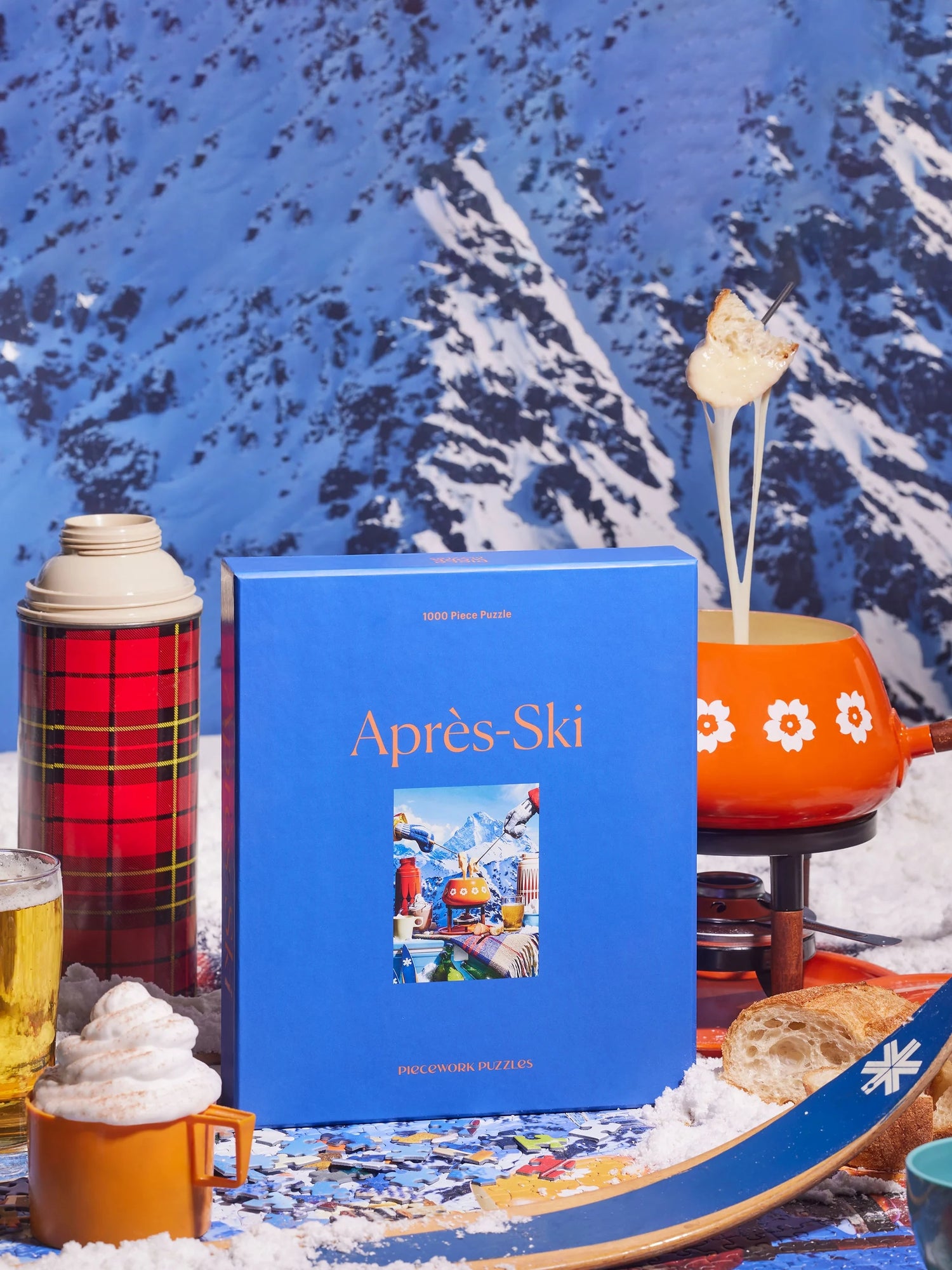 Blue puzzle box 'Apres-Ski' with a snowy mountain background