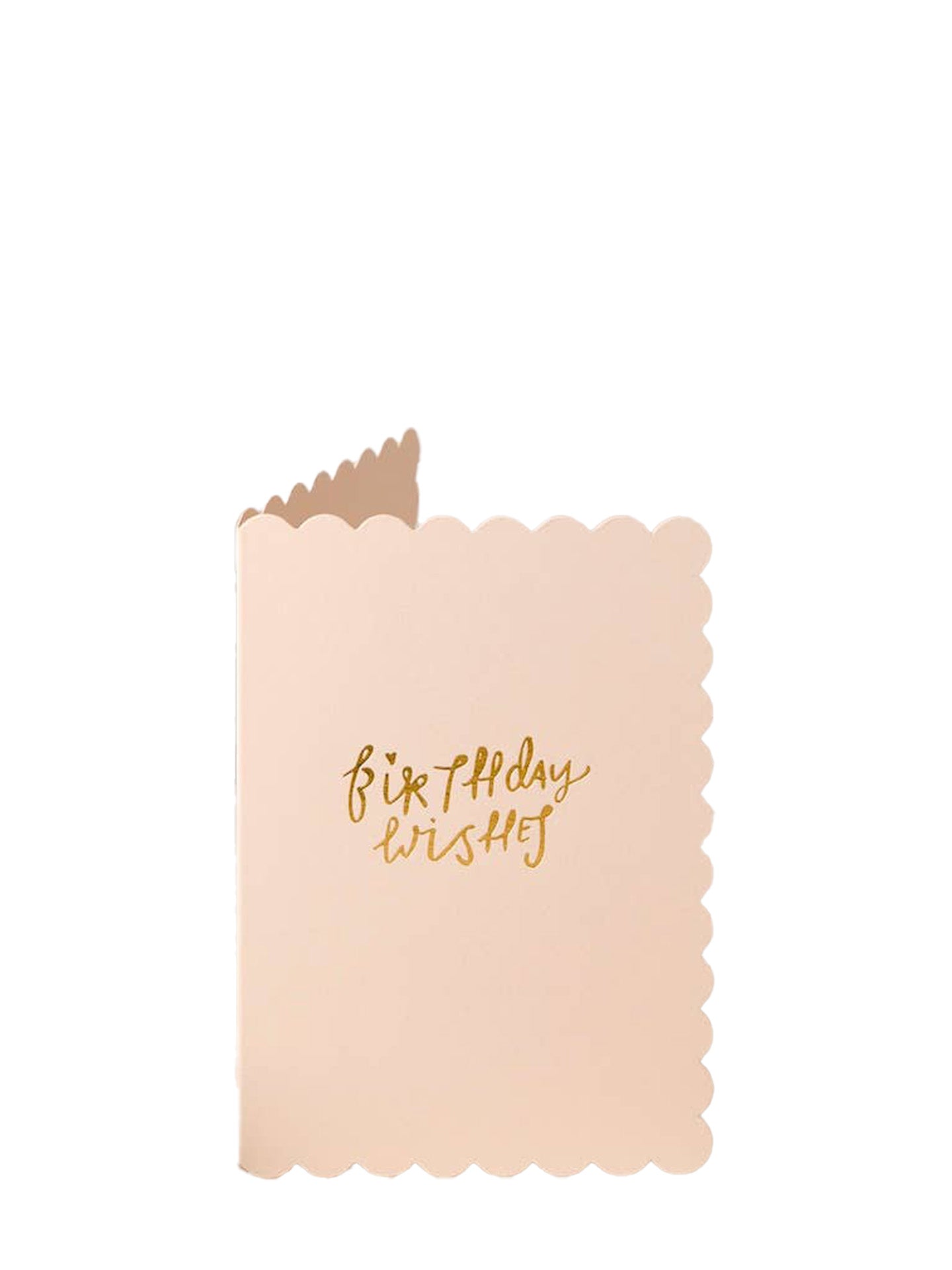 A pale blush pink greeting card with scalloped edges and gold foil text reading 'Birthday wishes' on a plain white background.