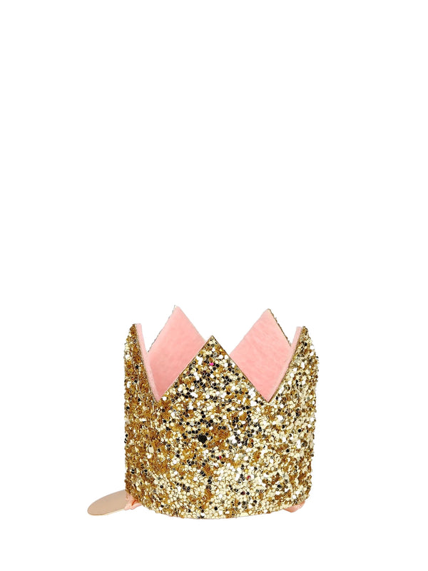 Gold glitter crown with pink interior on a white background