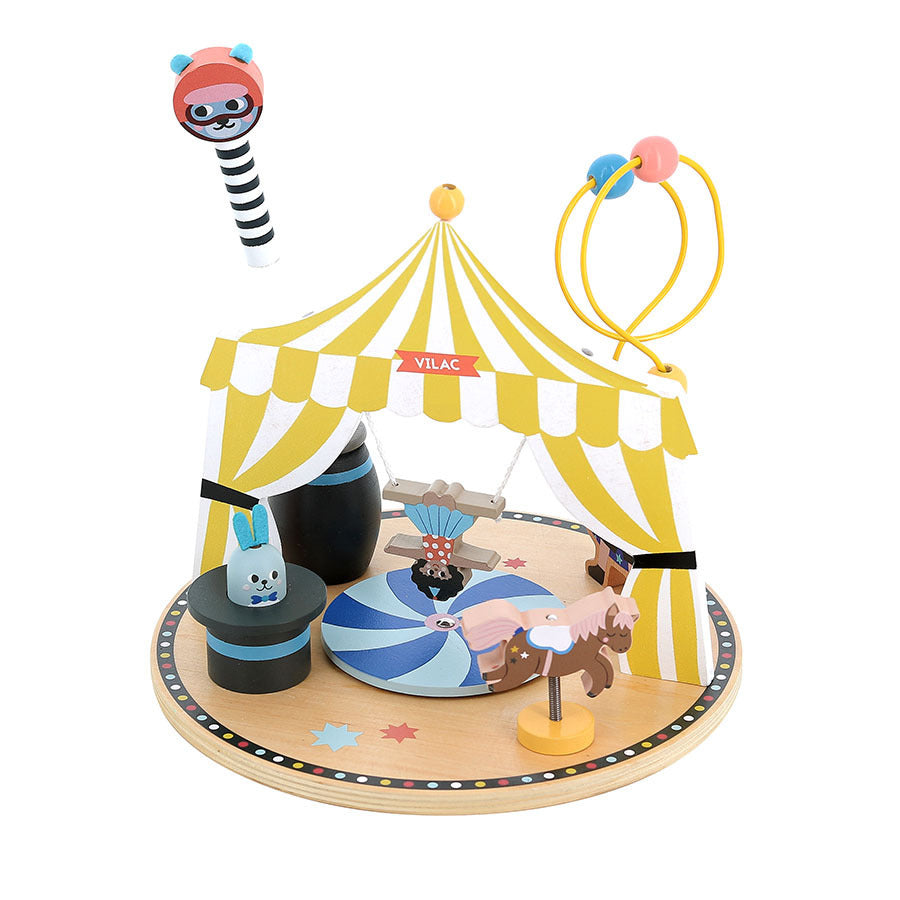 Toy circus set with a yellow and white striped tent, animals, and a clown on a white background.