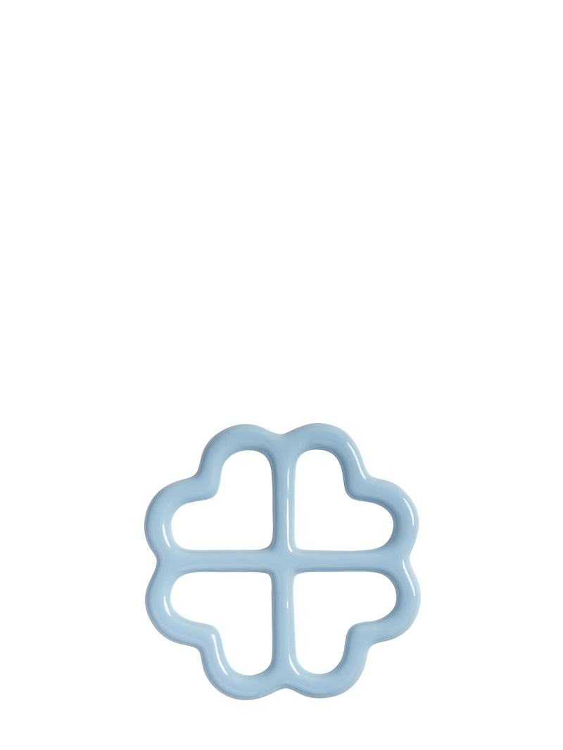 Pastel blue four-leaf clover shaped ceramic trivet, shown from upward on a plain white background.