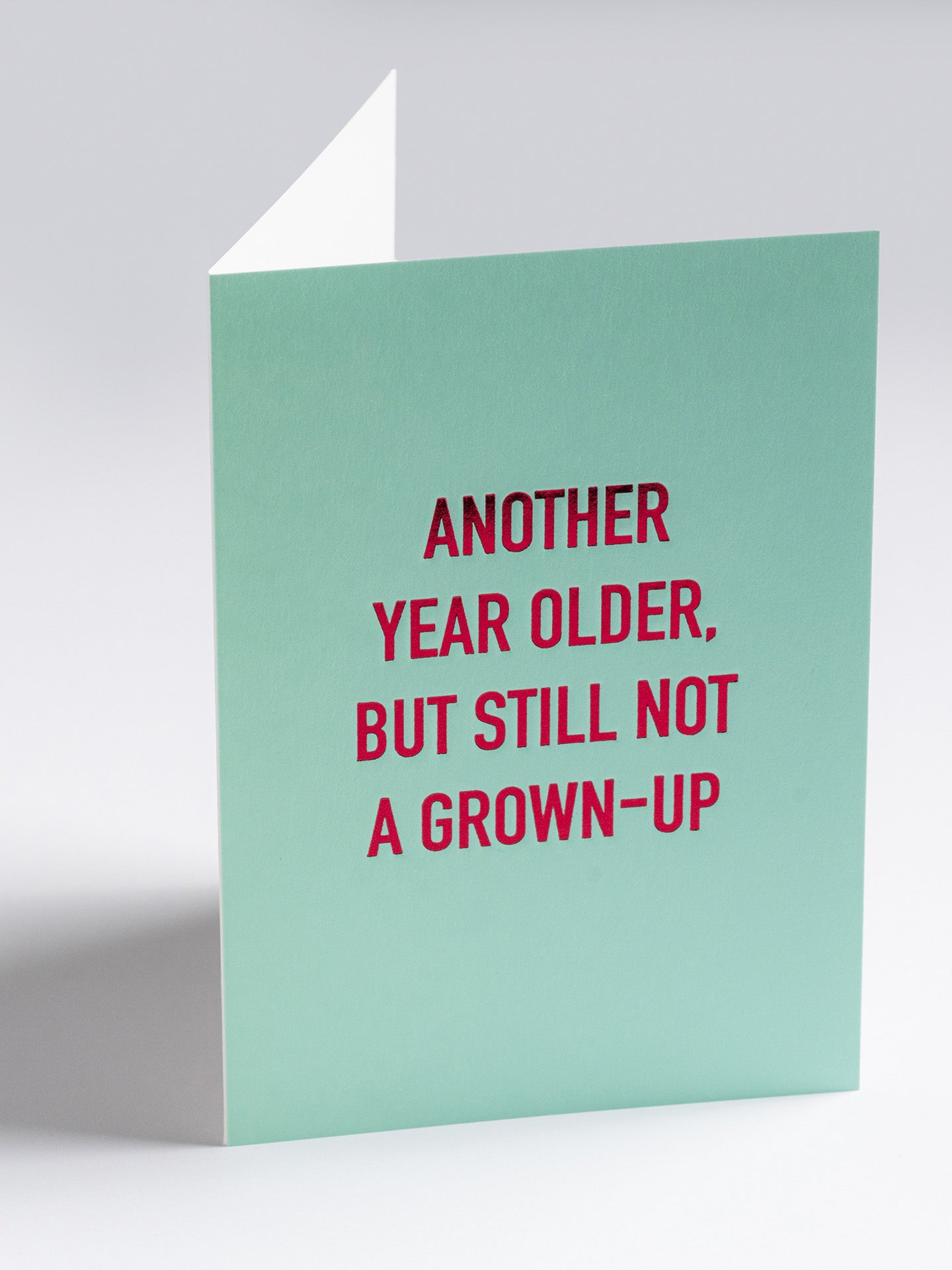 Another year older still not a grown up birthday card