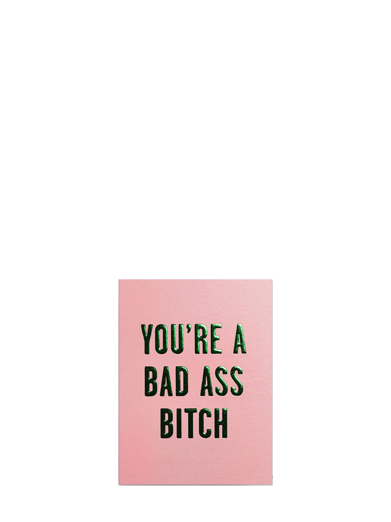 Pink mini card with bold green metallic shiny text YOU'RE A BAD ASS BITCH shown here on a white background