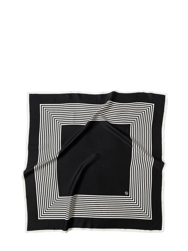 A square black silk scarf with a white geometric border pattern of concentric stripes, laid flat on a white background.