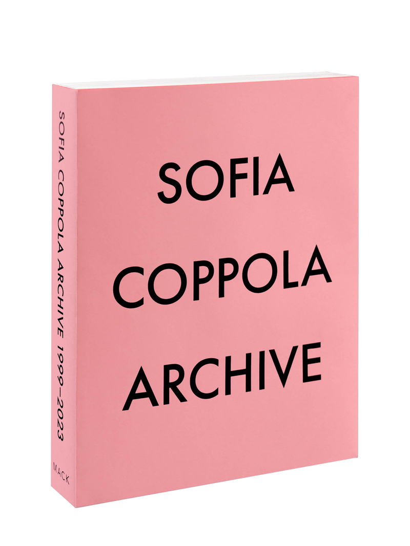 A pink hardcover book titled 'SOFIA COPPOLA ARCHIVE' with white and black text on the cover.