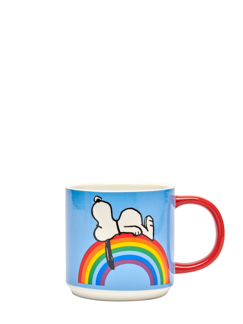 A colorful mug with a depiction of Snoopy lying on a rainbow on the front, and the phrase 'Good Vibes' on the side, with a red handle and a sky blue background.