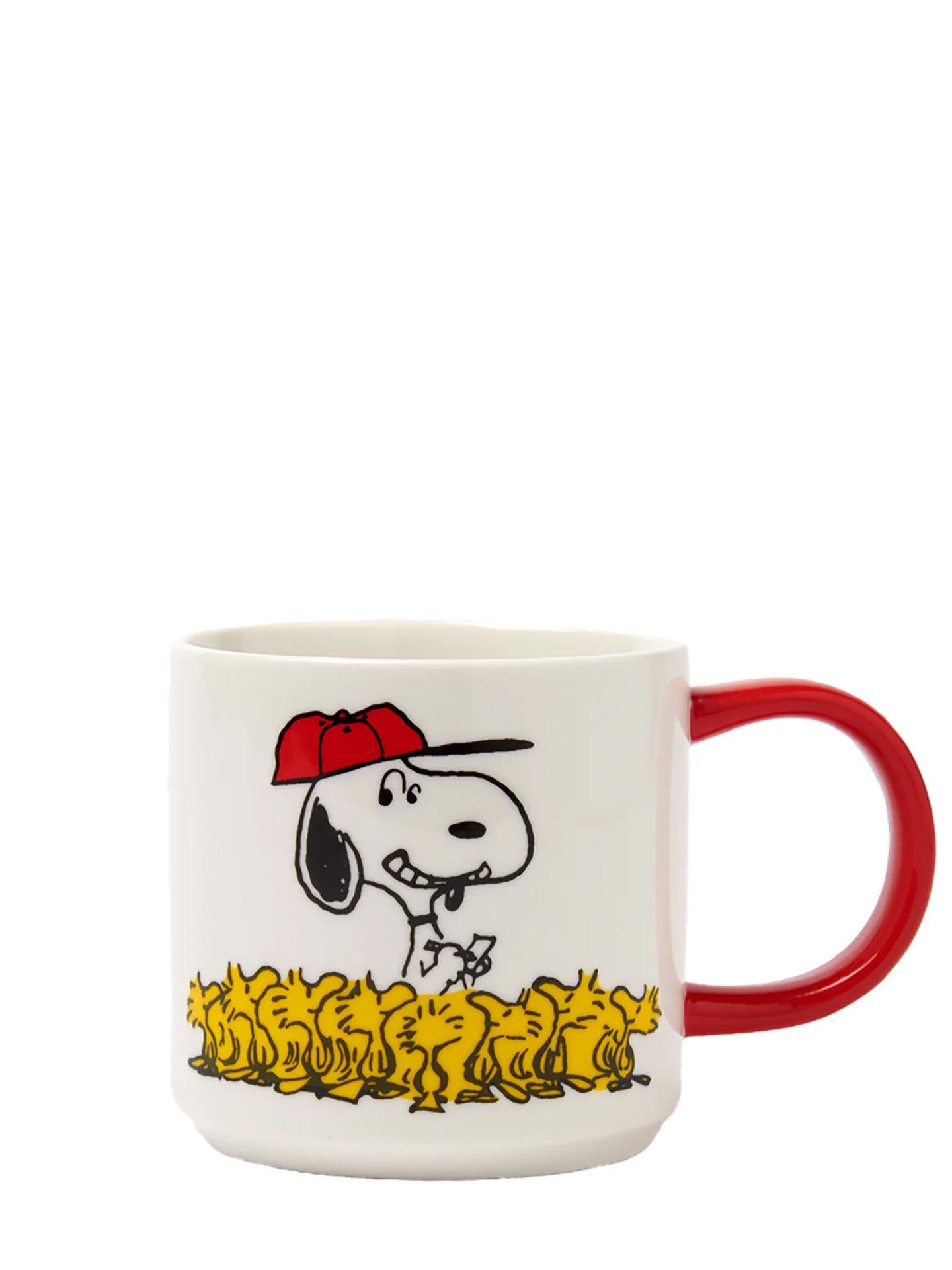 A white ceramic mug with a red handle featuring a cartoon illustration of Snoopy wearing a red bandana and sitting on a yellow ground.