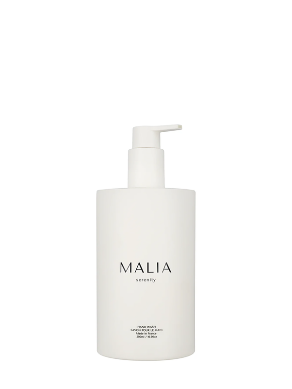 A white pump bottle of Malia hand wash with the brand name printed in black.