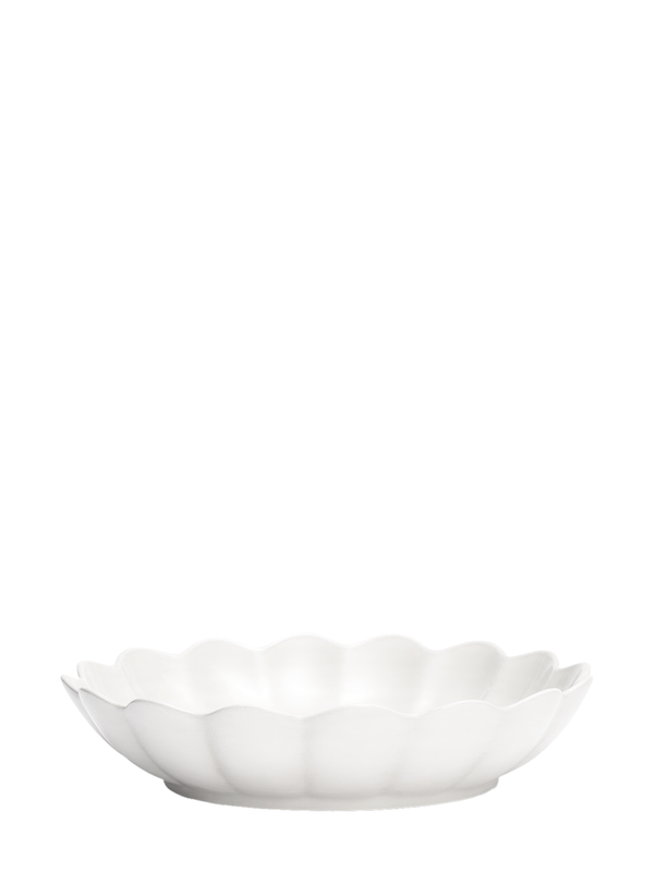 A large white ceramic oyster bowl with a scallop edge design.