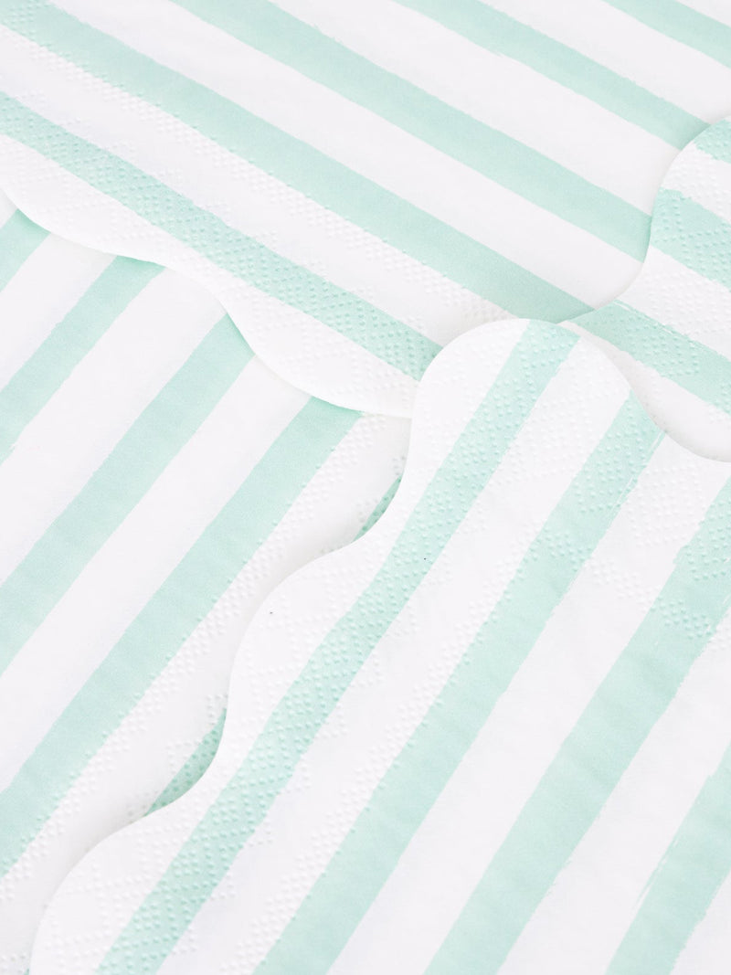 Close-up of striped napkins with scallop cut border and alternating light mint and white stripes.