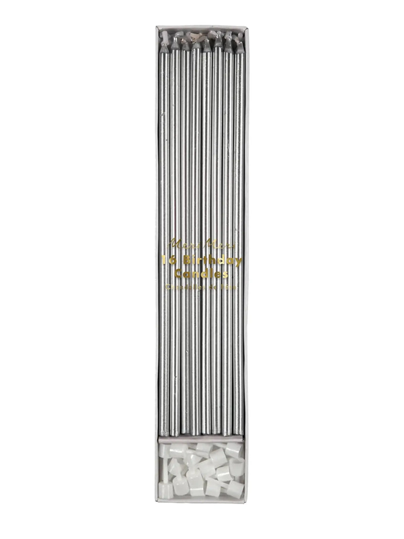 A boxed set of metallic silver birthday candles with gold foil text reading 'Happy Birthday candles' on a plain white background.