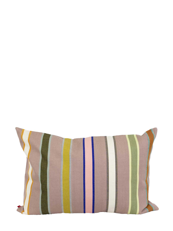A rectangular throw pillow with a vertical striped pattern in muted earthy tones, including dusty pink, olive green, mustard yellow, blue, and white, set against a plain white background.