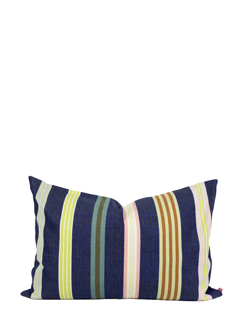 A square throw pillow with vertical stripes in navy blue, olive green, light green, pink, brown, and yellow, set against a plain white background.