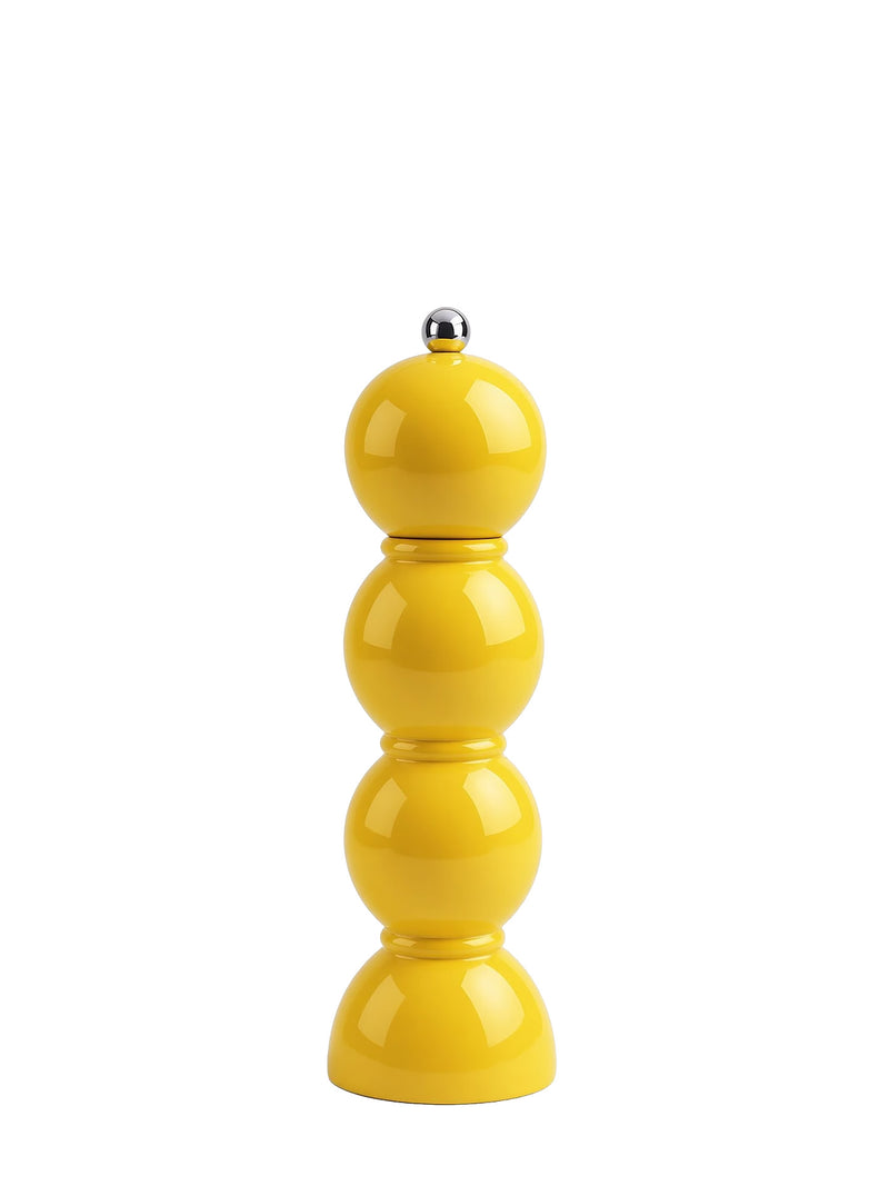 A bright yellow ceramic pepper mill with a stacked, rounded design and a small silver metal knob on top, set against a plain white background.
