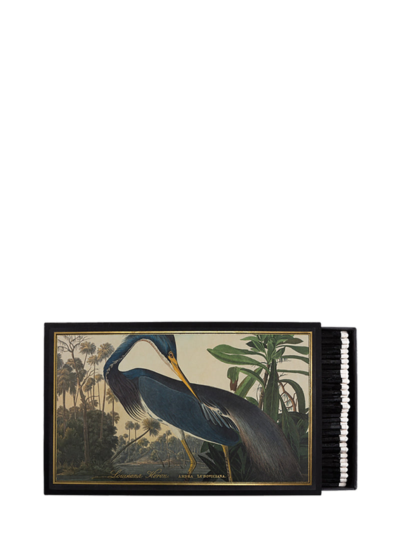 Decorative black match box with a heron illustration and some white-tipped black match sticks peeking on a white background