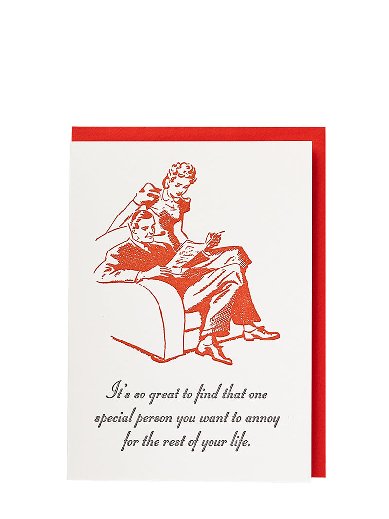 Greeting card with red illustration of a couple and text on a white background