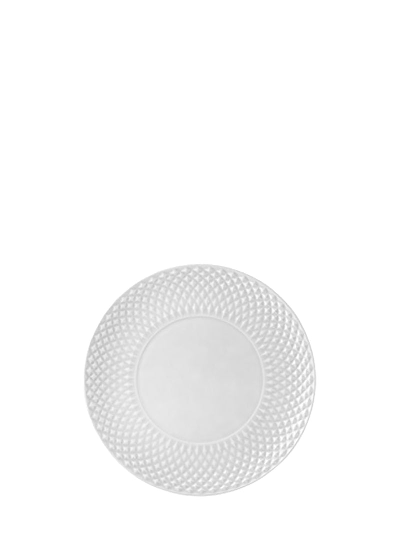 White decorative plate with textured rim on a white background