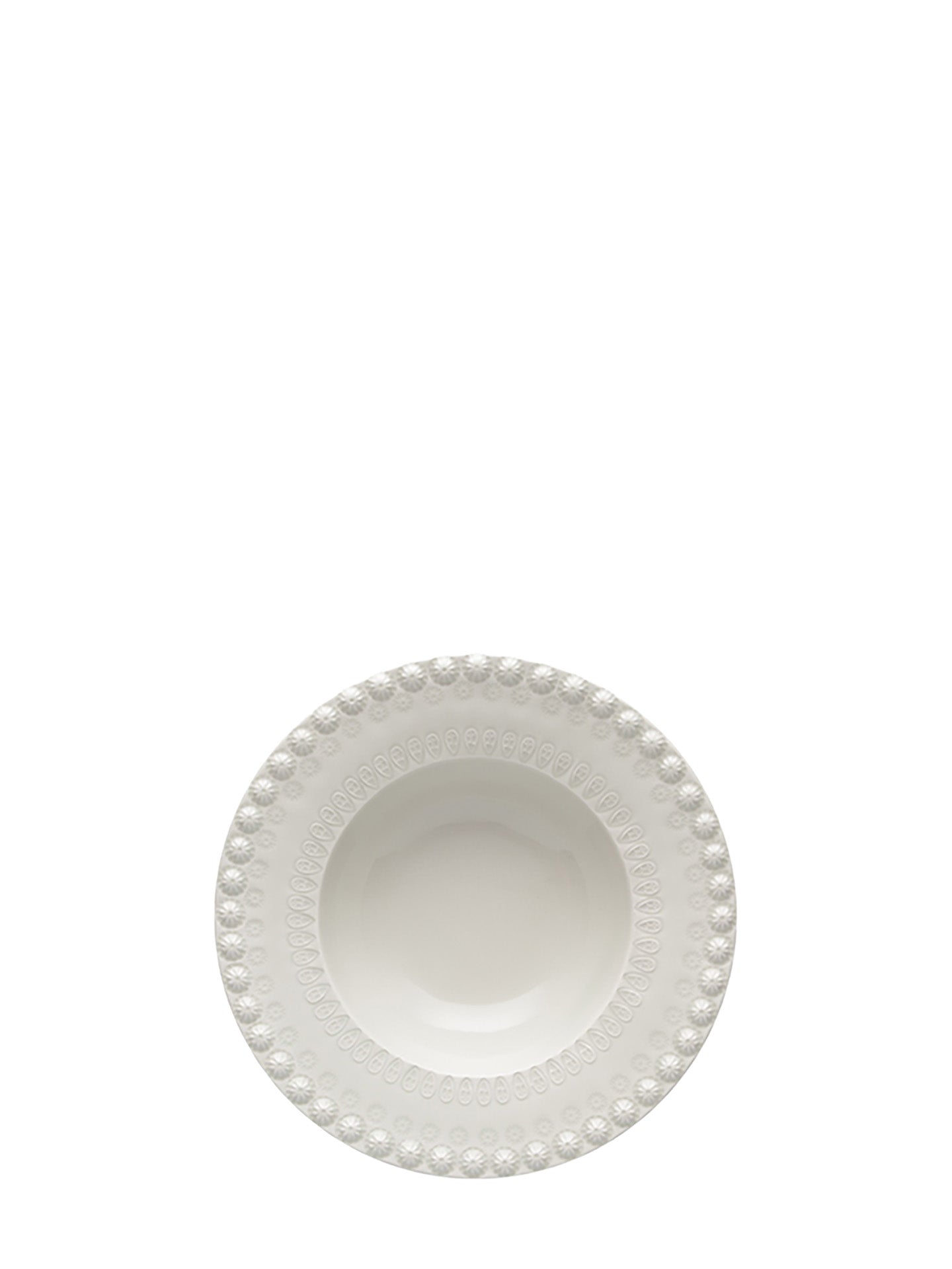 White ceramic bowl with decorative rim on a white background