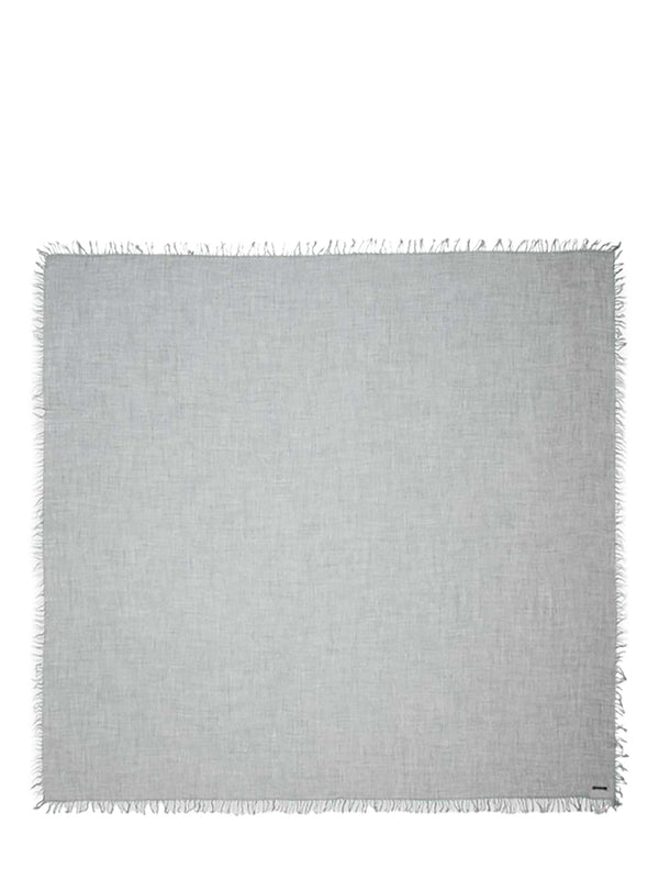 A light gray woven scarf with fringed edges, displayed flat against a solid white background.