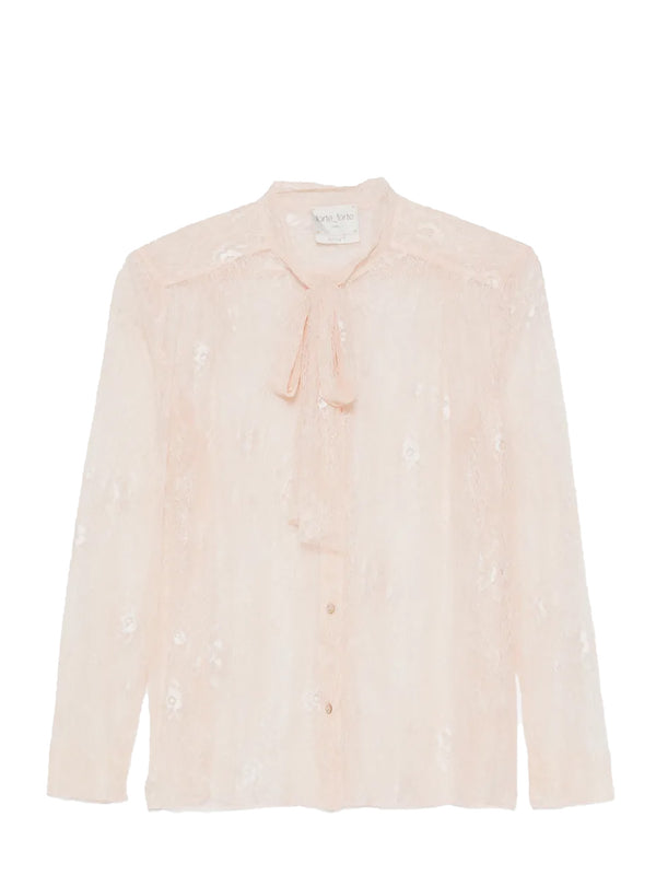 A pale blush pink long-sleeve blouse with a tie-neck detail and subtle floral embroidery, shown flat against a white background.