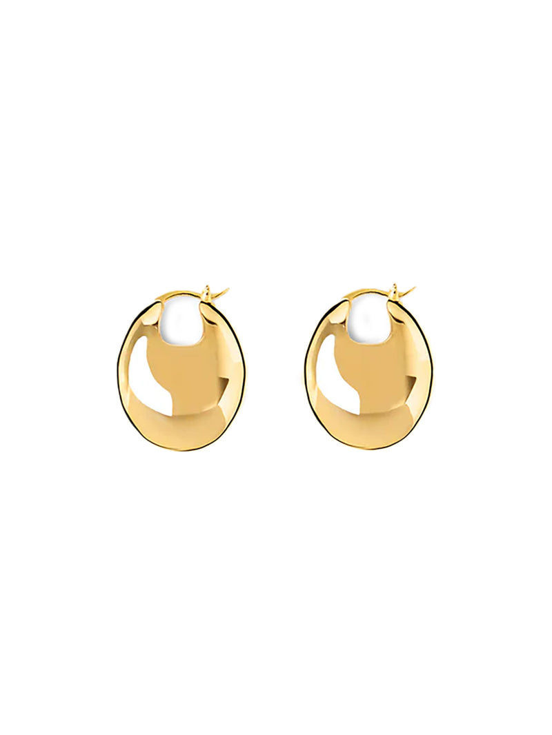 A pair of gold-toned, polished oval hoop earrings with a small white accent at the top, displayed on a clean white background.