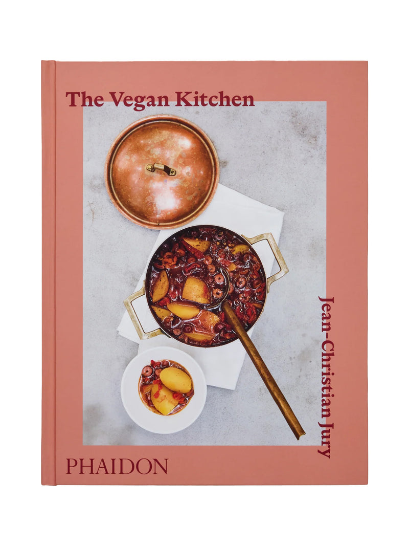 Book cover of 'The Vegan Kitchen' by Jean-Christian Jury for Phaidon with a photo of a dish on grey table and a pink frames shot on a white background