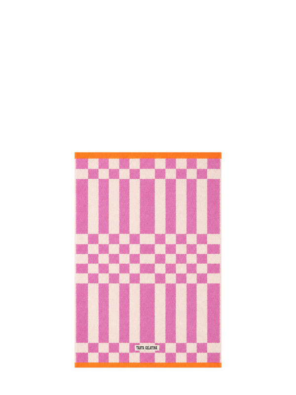 A rectangular pink and white checkered kitchen towel with orange borders on the top and bottom, featuring a small white Tarta Gelatina brand label at the bottom.