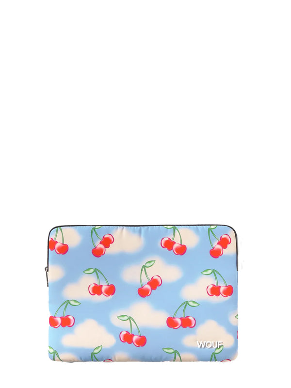 Laptop sleeve with cherry and cloud pattern on a blue background
