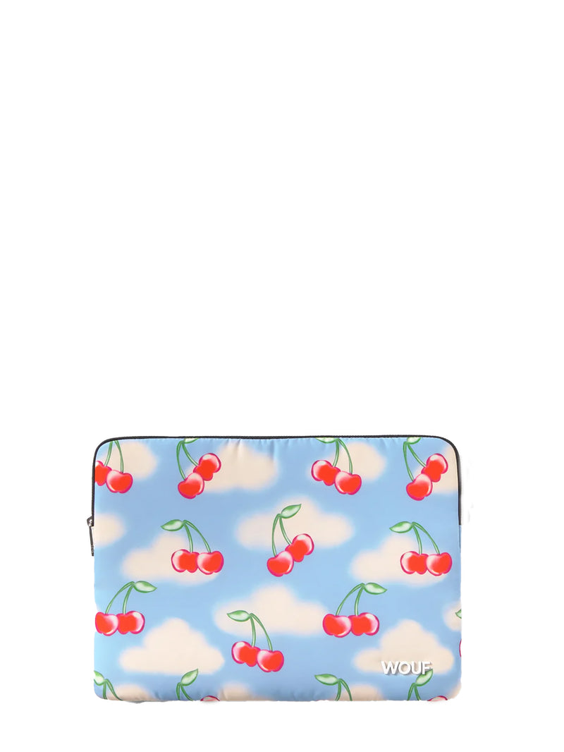 Laptop sleeve with cherry and cloud pattern on a blue background
