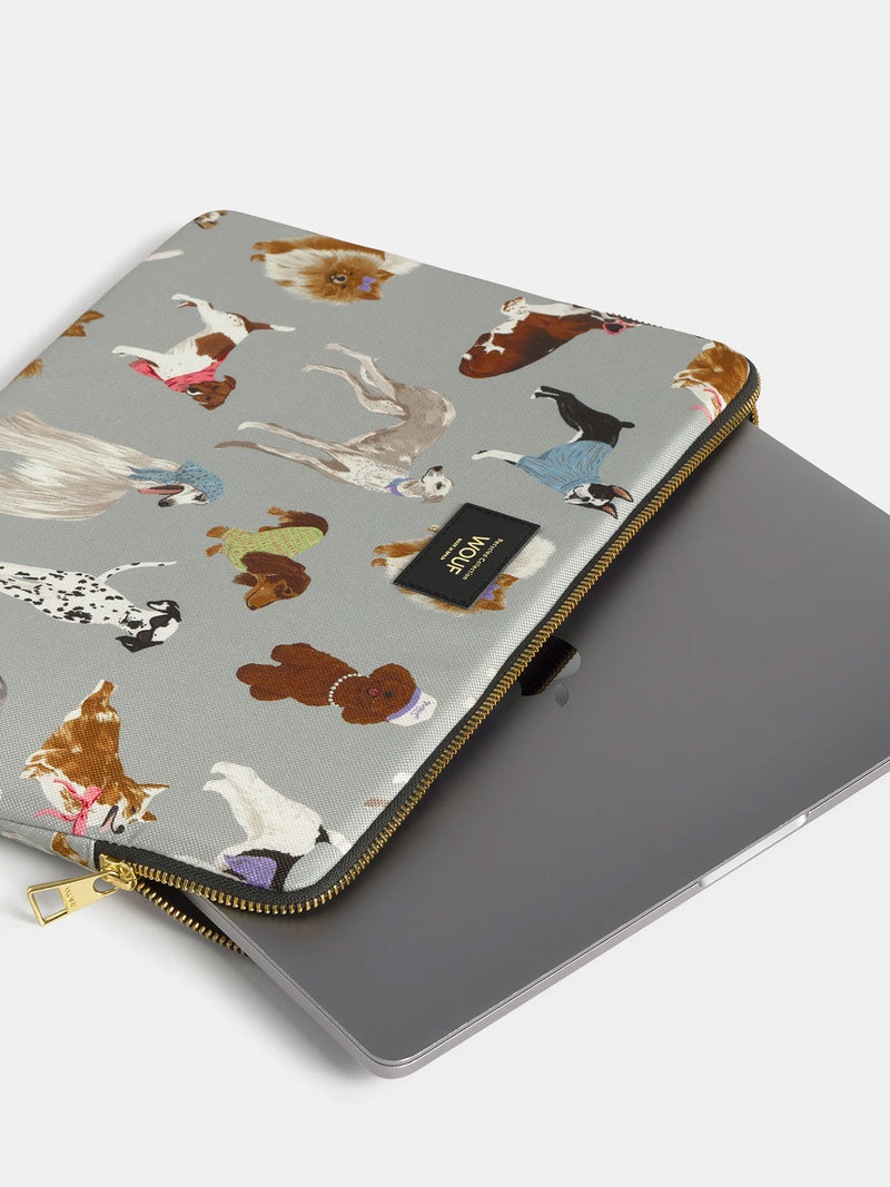 Laptop sleeve with dog pattern cover on a white background
