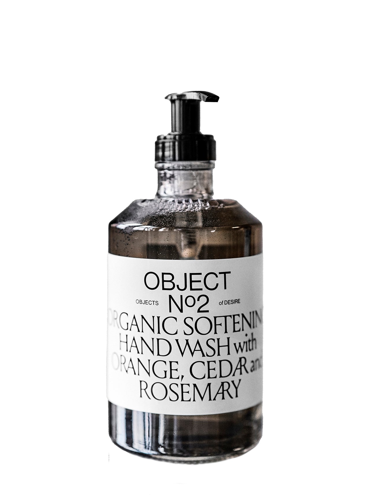A dark glass bottle of hand soap with a pump dispenser, labeled 'OBJECT N°2 Organic Softening Hand Wash with Orange, Cedar, Rosemary'.