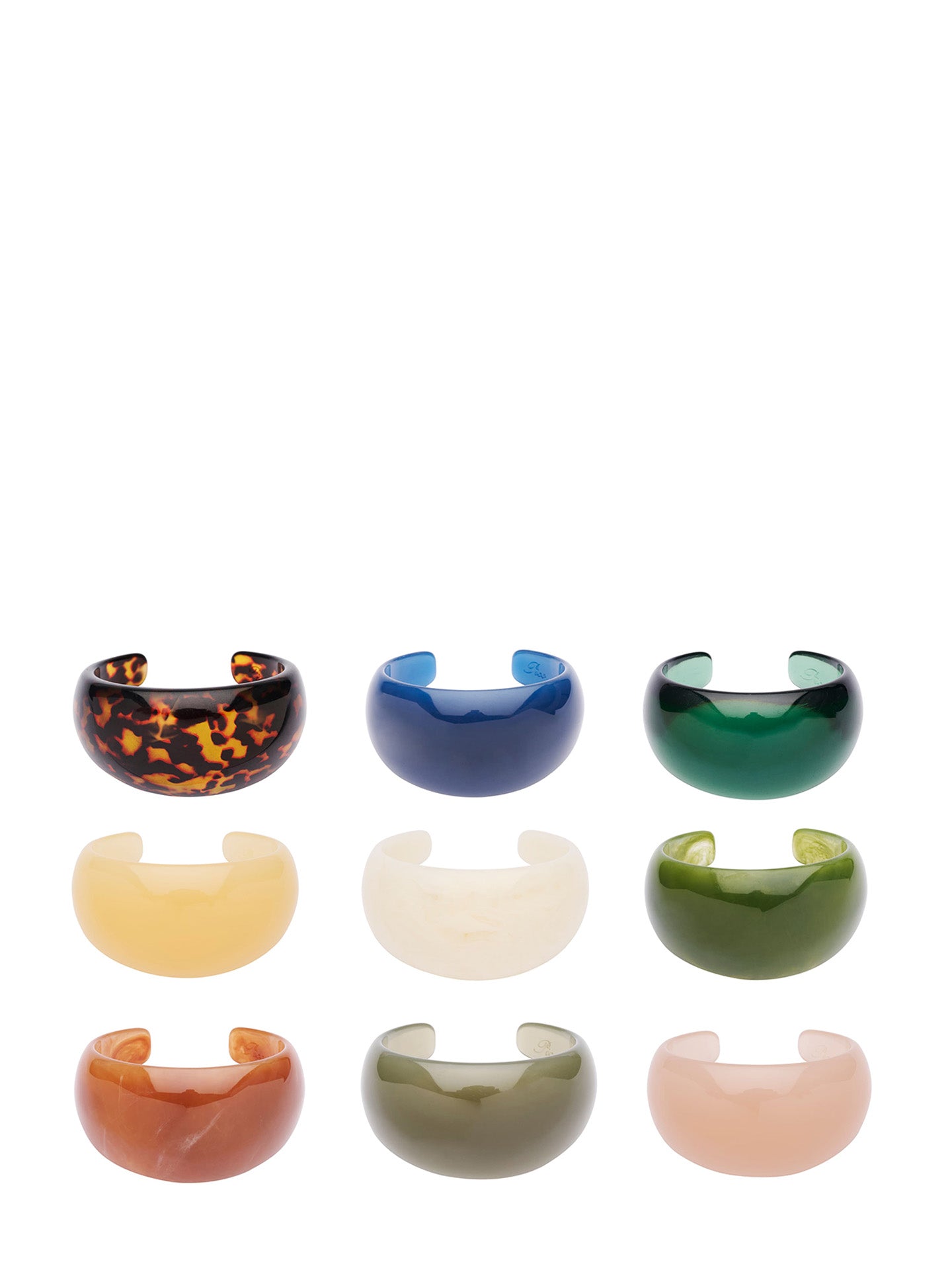 Nine resin cuff rings in various colors and patterns are arranged in a 3x3 grid on a solid white background. The designs include solid colors like blue, muted green, butter yellow, orange, khaki green, and powder pink, as well as clear designs in bottle green and black and brown tortoiseshell pattern.