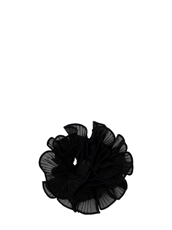A large black ruffled sheer mesh hair scrunchie on a solid white background.