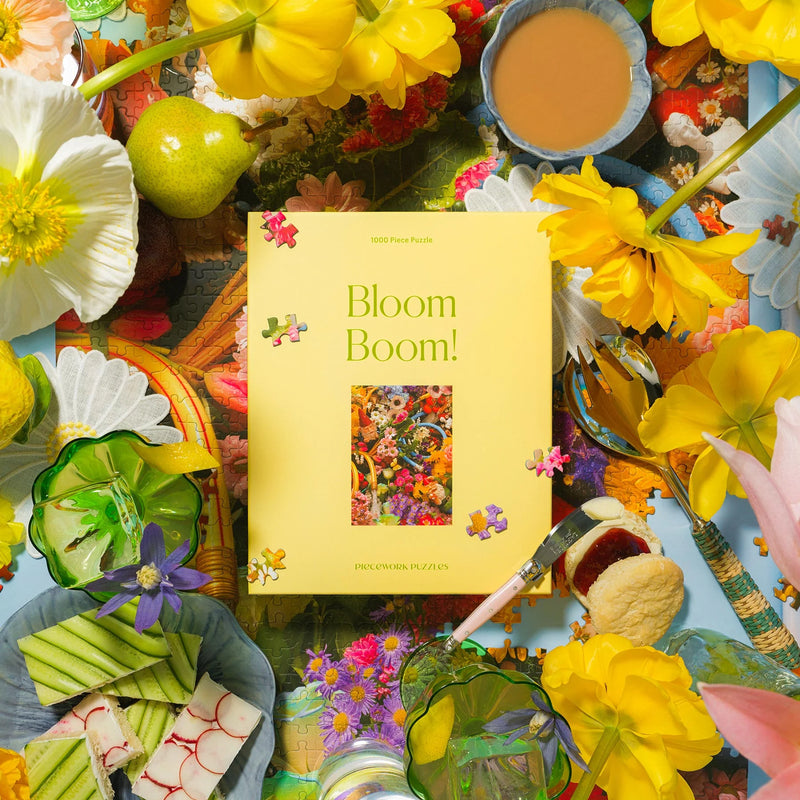 Floral-themed product packaging with 'Bloom Boom!' text surrounded by flowers and decorative items.