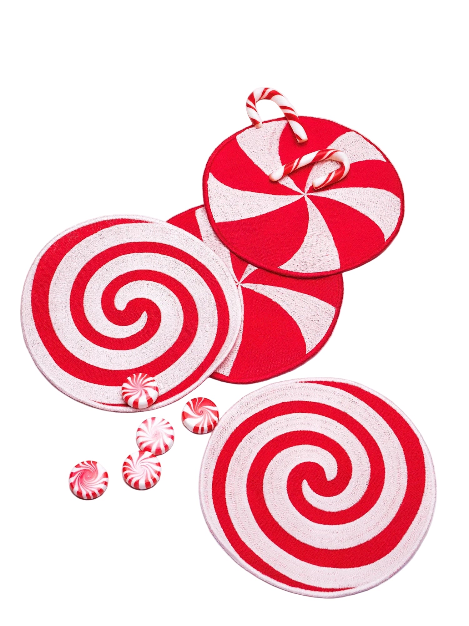 Red and white candy-themed coasters on a light background