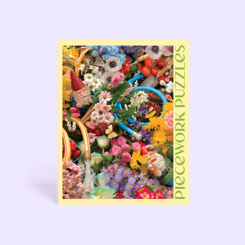 Jigsaw puzzle box with colorful garden-themed design on a light purple background