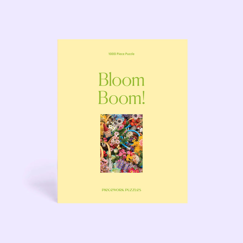 Puzzle box titled 'Bloom Boom!' with a colorful floral design on a light purple background